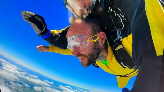 Man skydiving in tandem during freefall