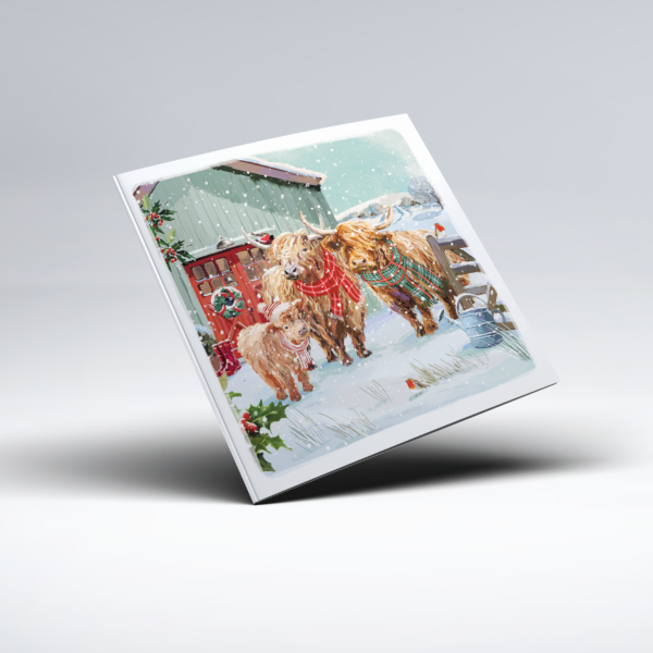 Illustrated Christmas card showing three shaggy Highland cows standing together in a snow-covered farmyard, each wearing a colourful tartan scarf. A barn with a festive wreath, wooden fencing, holly and falling snow fill the winter background.