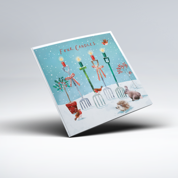 Illustrated Christmas card showing four tall, differently coloured garden forks, with lit candles on top of them, standing in a snowy garden. Robins, a rabbit, hedgehog, red berries and winter foliage surround the candles, with the words "Four Candles" at the top.