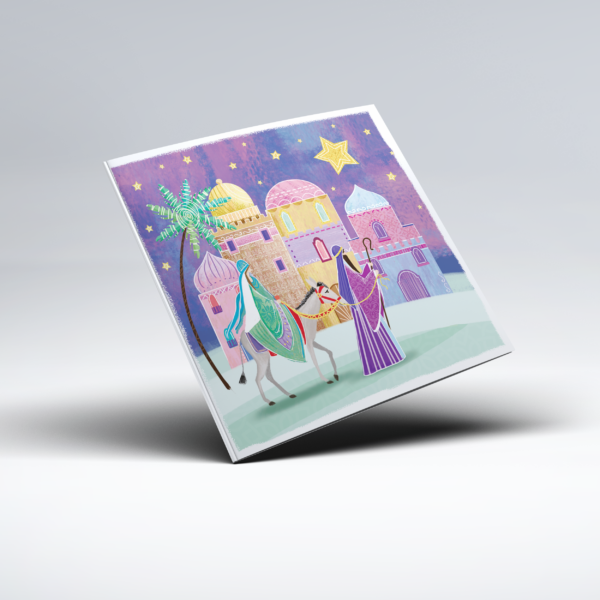 Colourful illustrated Christmas card depicting figures travelling towards a town of pink, purple and golden domed buildings, with one figure riding a donkey and another walking alongside. The scene depicts the traditional story of the first Christmas. Palm trees and stars decorate the purple night sky, with a large golden star shining above the town.