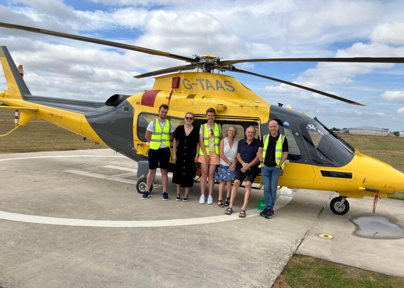 Joe and his family in front of our helicopter, on a base visit.
