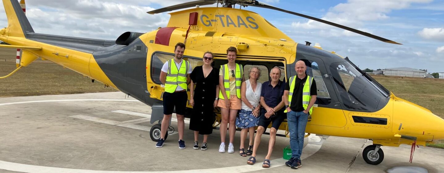 Joe and his family in front of our helicopter, on a base visit.