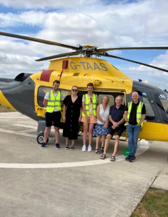 Joe and his family in front of our helicopter, on a base visit.