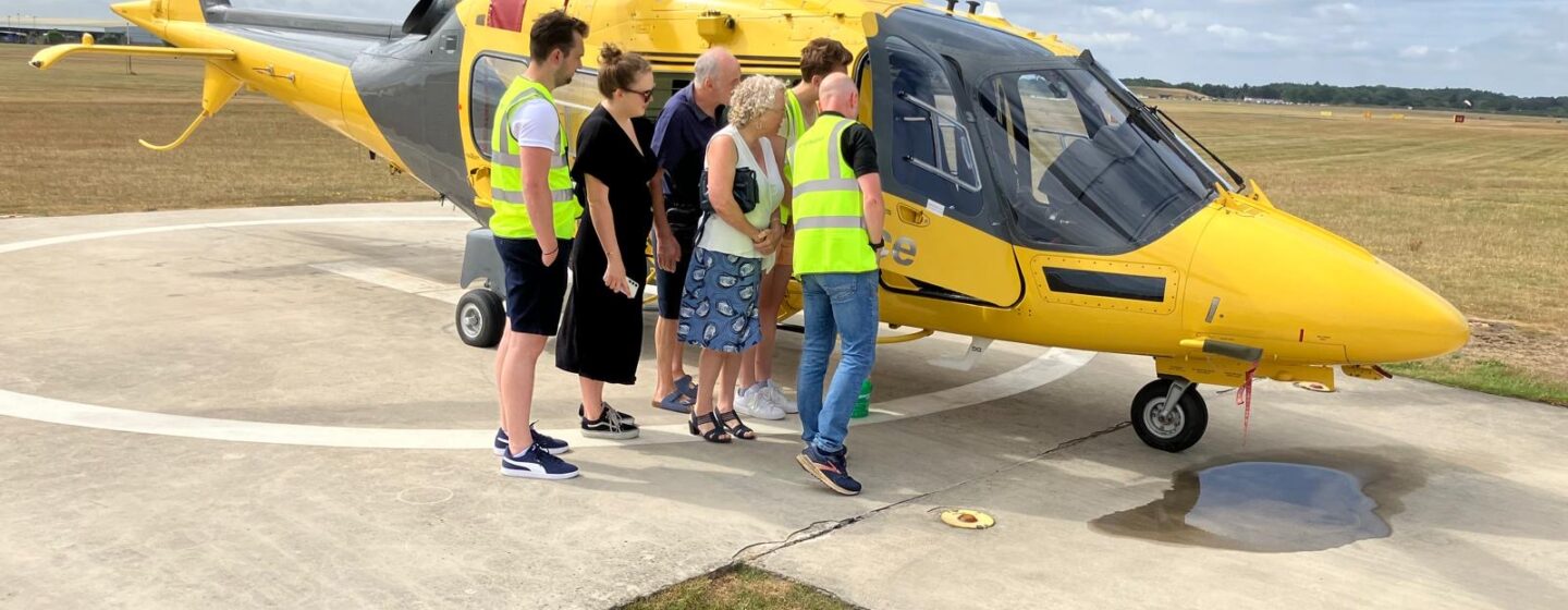 Joe and his family on a base visit, looking into our helicopter