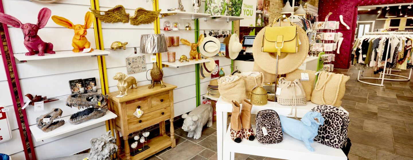 The inside of a YLAA charity shop, with shelves of accessories.