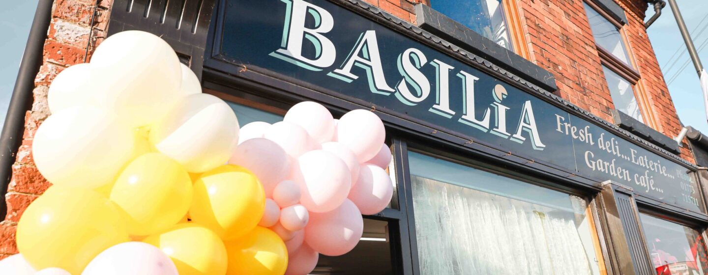 Basilia Cafe storefront with balloon arches