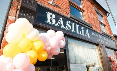 Basilia Cafe storefront with balloon arches