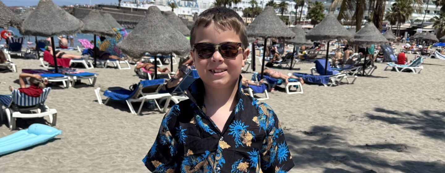 Fred on holiday, at the beach, wearing a Hawaiian shirt