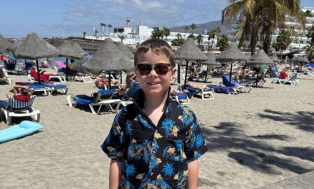 Fred on holiday, at the beach, wearing a Hawaiian shirt