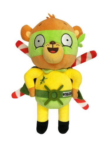 Front facing photograph of stuffed bear plush, Blade - our TCAA mascot. He's wearing a yellow top, and a green cape and mask. On his back are helicopter blades.