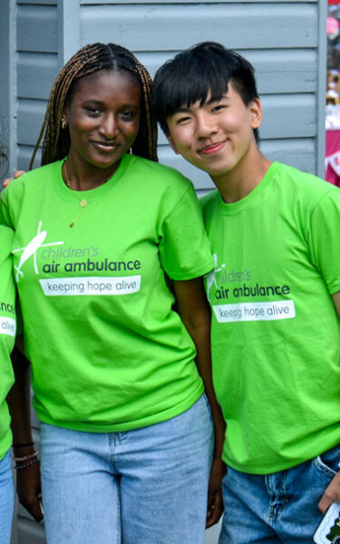 Two TCAA student volunteers smiling.