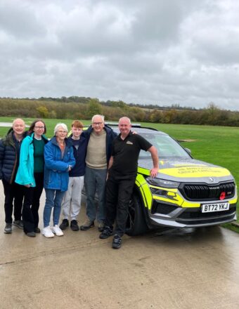 Tony Thomas and his family on a base visit, in front of one of our critical care cars.
